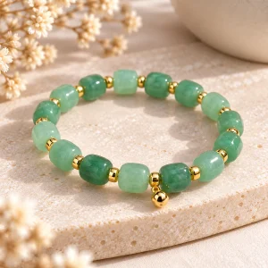 Bracelet jade perles tonneau, intercalaires dorés