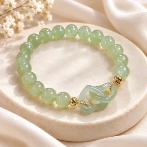 Bracelet de jade au noeud sculpté, deux boucles entrelacées